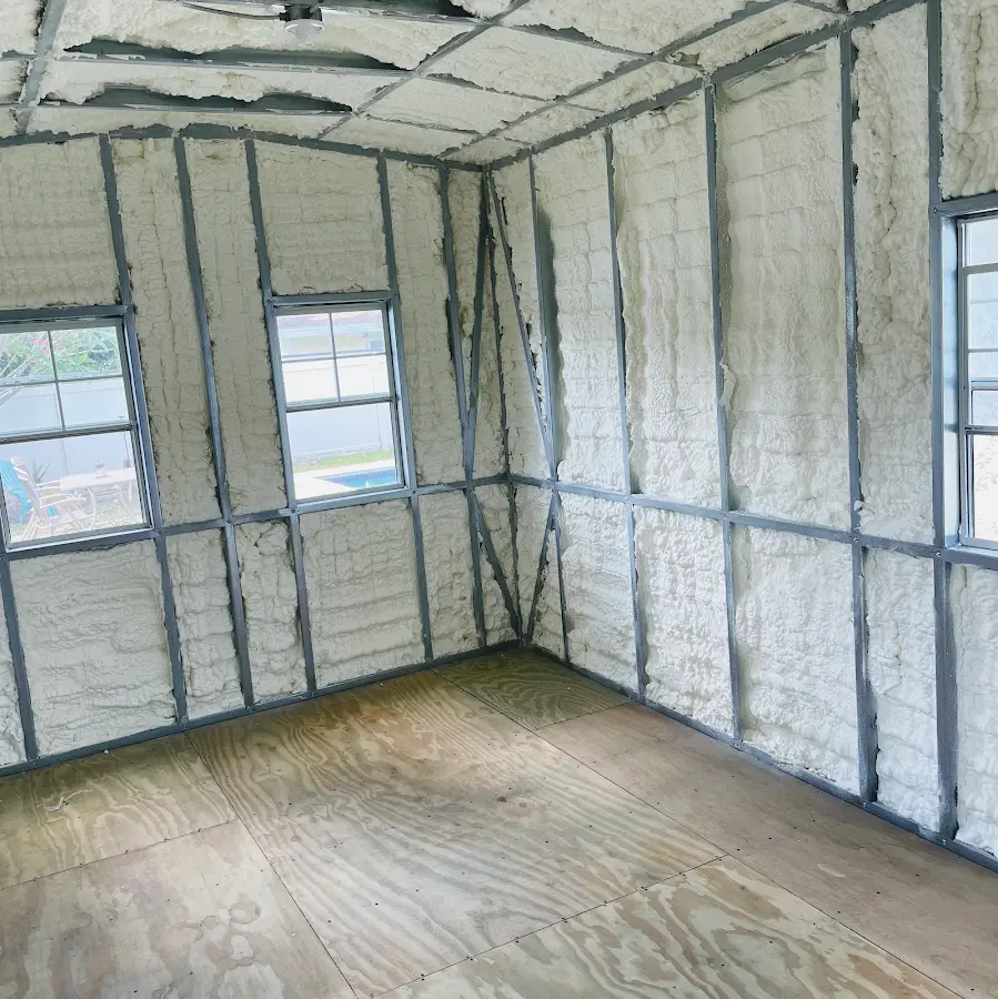 Closed-cell spray foam insulation applied to wall cavities in a residential project in Midway